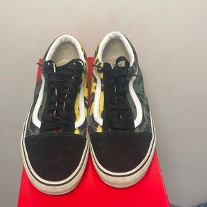 Green, yellow , and black vans with box